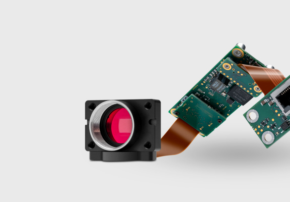 On the right, an IDS ACP customized camera on a white background.